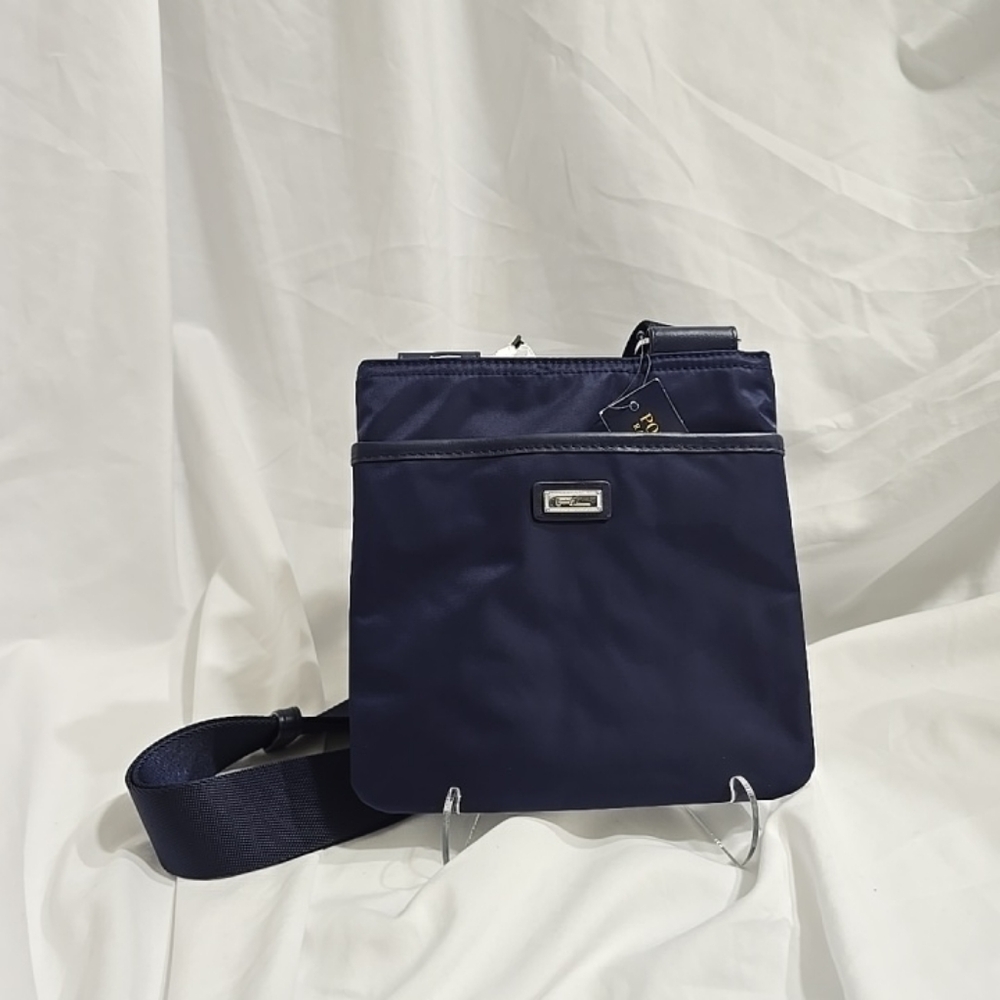 The NWT Polo Golf Ralph Lauren Nylon Crossbody Bag in French Navy Blue is a styl